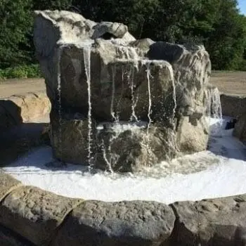Stone waterfall with flowing water