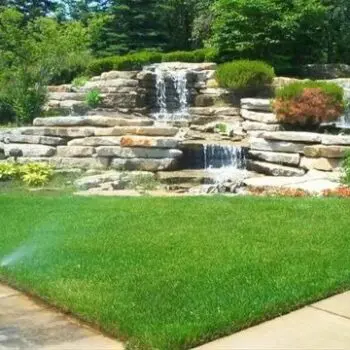 Lush garden waterfall landscaping patio