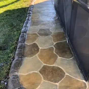Decorative concrete patio pathway installation