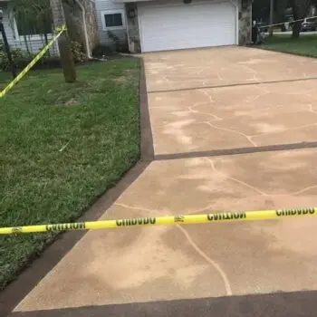 Newly installed concrete driveway repair