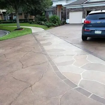 Concrete driveway with car parked