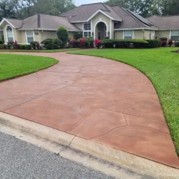 Concrete driveway leading to house