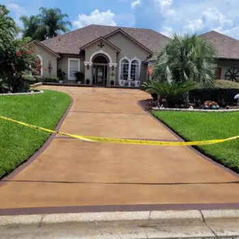 Newly installed concrete driveway house