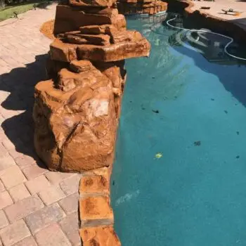 Decorative stone pool edge installation