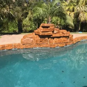 Poolside rock feature installation