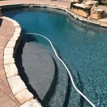 Backyard pool with stone edging