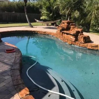 Backyard pool with stone features