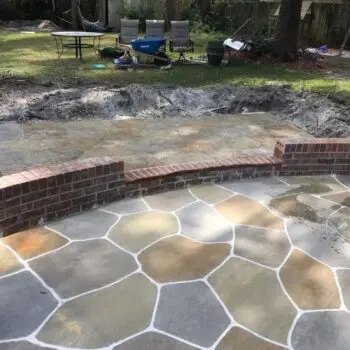 Concrete patio with brick edge