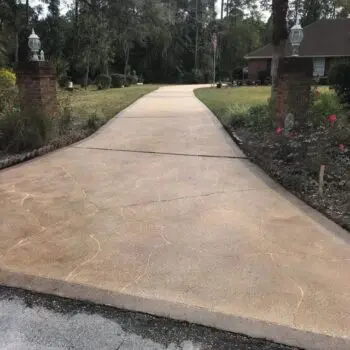 Concrete driveway with garden surroundings
