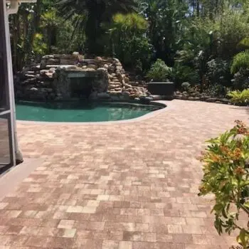 Brick patio pool with waterfall