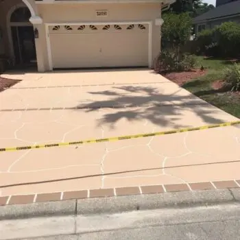 Concrete driveway with caution tape