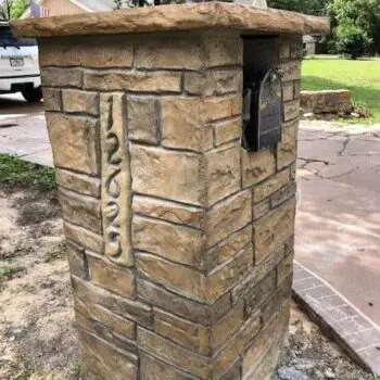 Rustic stone mailbox concrete driveway