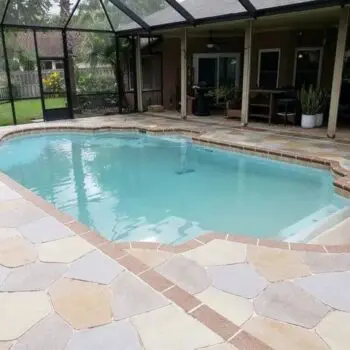 Backyard pool with concrete patio