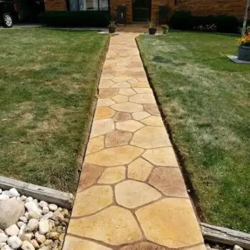 Stamped concrete walkway residential installation