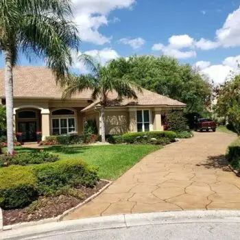 Concrete driveway tropical landscape design