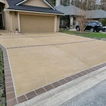 Stamped concrete driveway with bricks