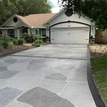 Concrete driveway leading to house