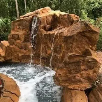 Rock waterfall concrete pool design