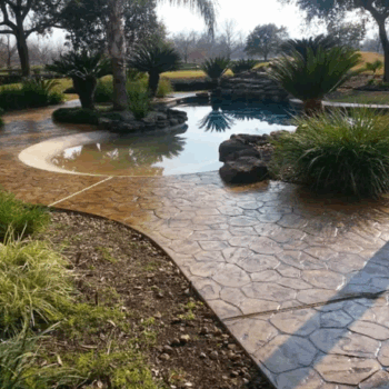 Stamped concrete poolside design landscaping