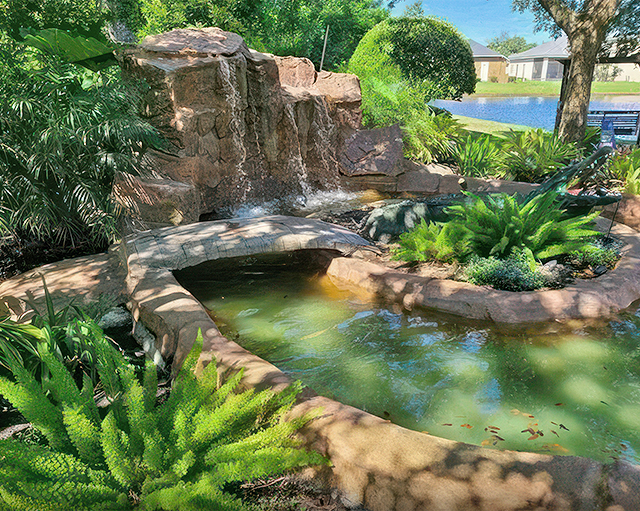 Garden pond with stone waterfall